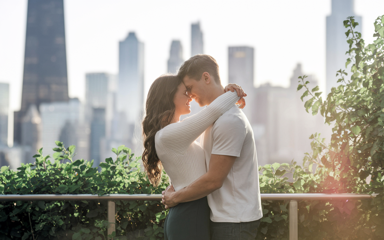 A couple embracing on a sun-drenched balcony, surrounded by lush greenery, conveying warmth and love. They share a tender moment, lost in each other’s eyes, emphasizing the power of physical affection to alleviate stress. The backdrop of a busy city skyline blends with the couple's calm, illustrating how quiet moments of connection exist amidst the rush of residency life.