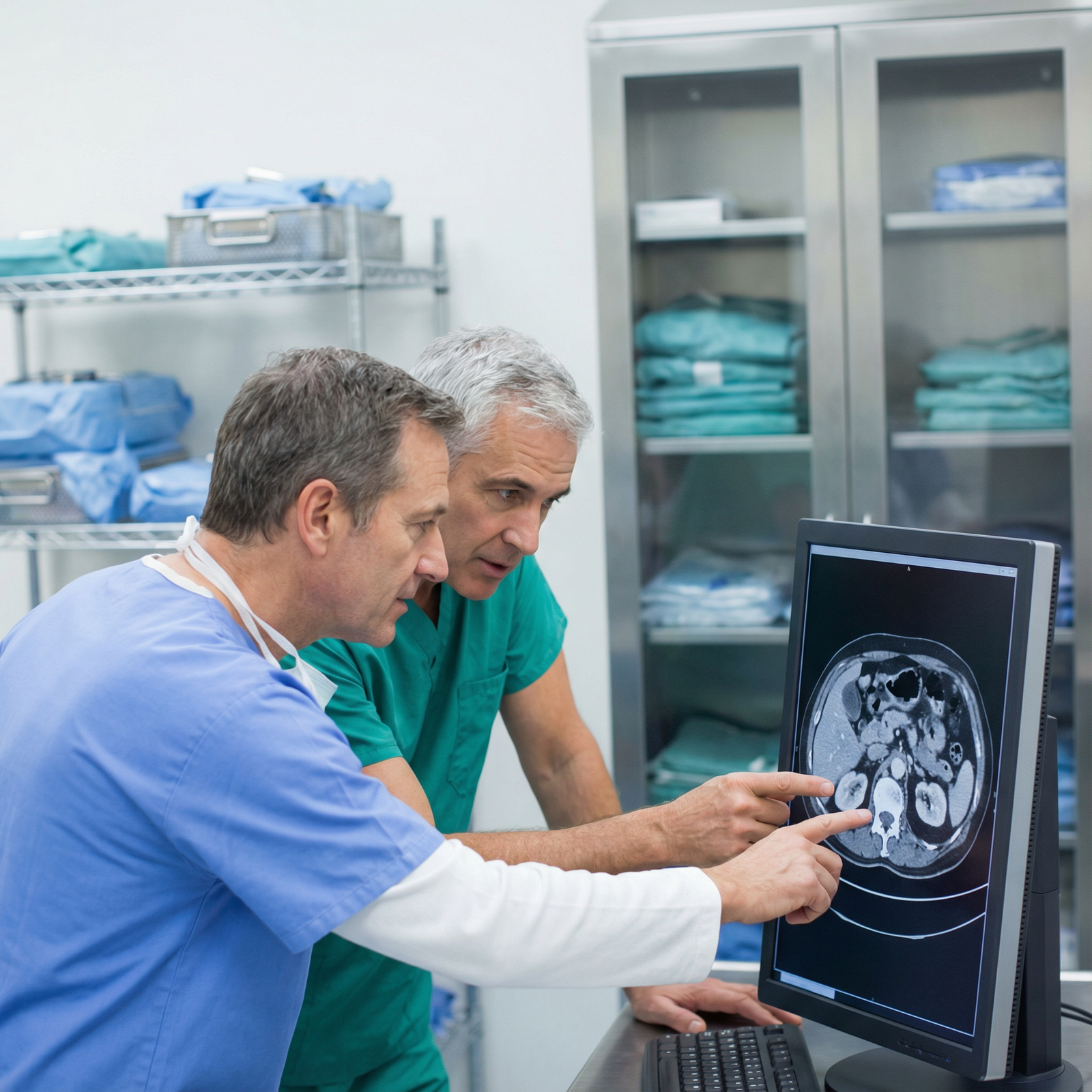 Medical student working with surgical mentor in an operating room anteroom Medical student working with surgical mentor in an operating room anteroom - General Surgery for Mastering Your General Surge