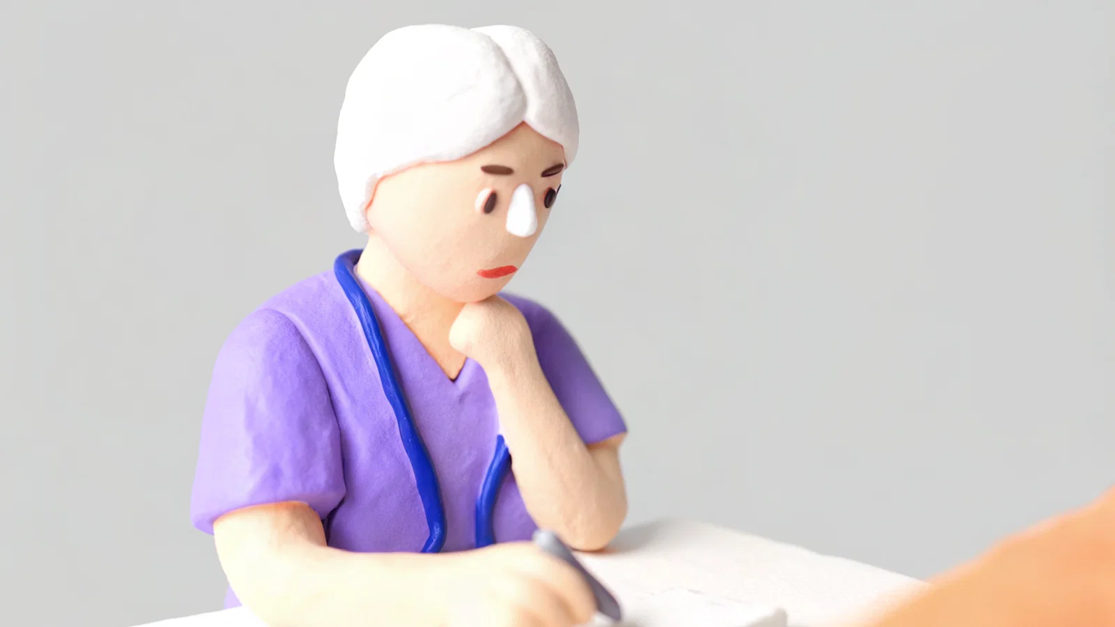 Worried dual-doctor couple reviewing job postings at night