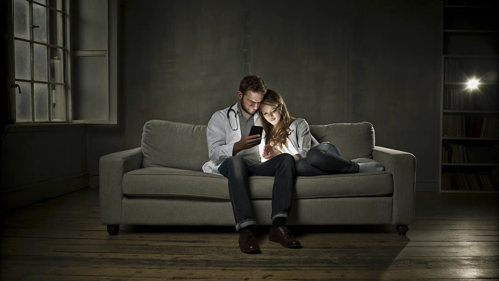Couple checking emails anxiously