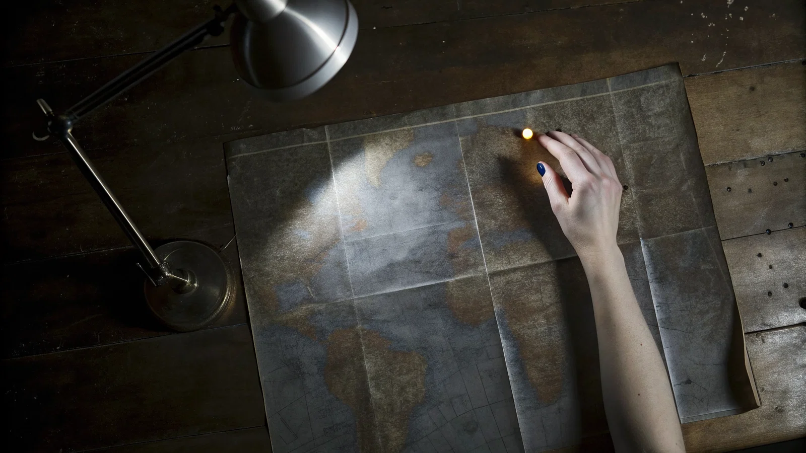 Stressed medical student looking at a map of global clinical rotations
