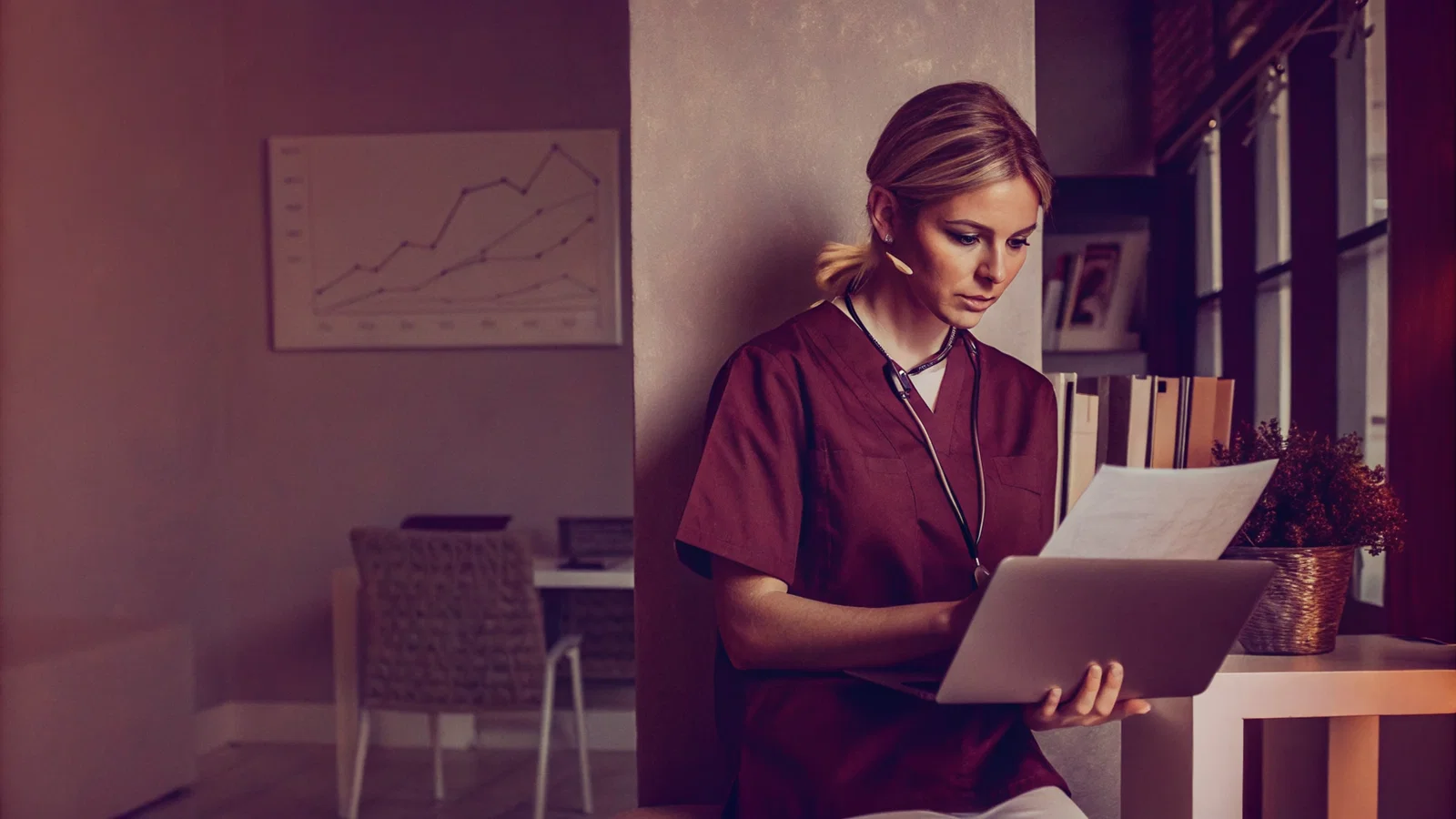Residency applicant waiting beside a laptop and recommendation folders