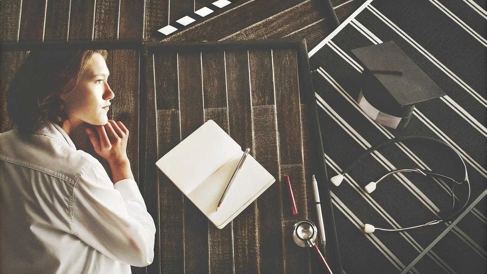 Cover image: Applicant drafting a personal statement beside a calendar and flagged checklist