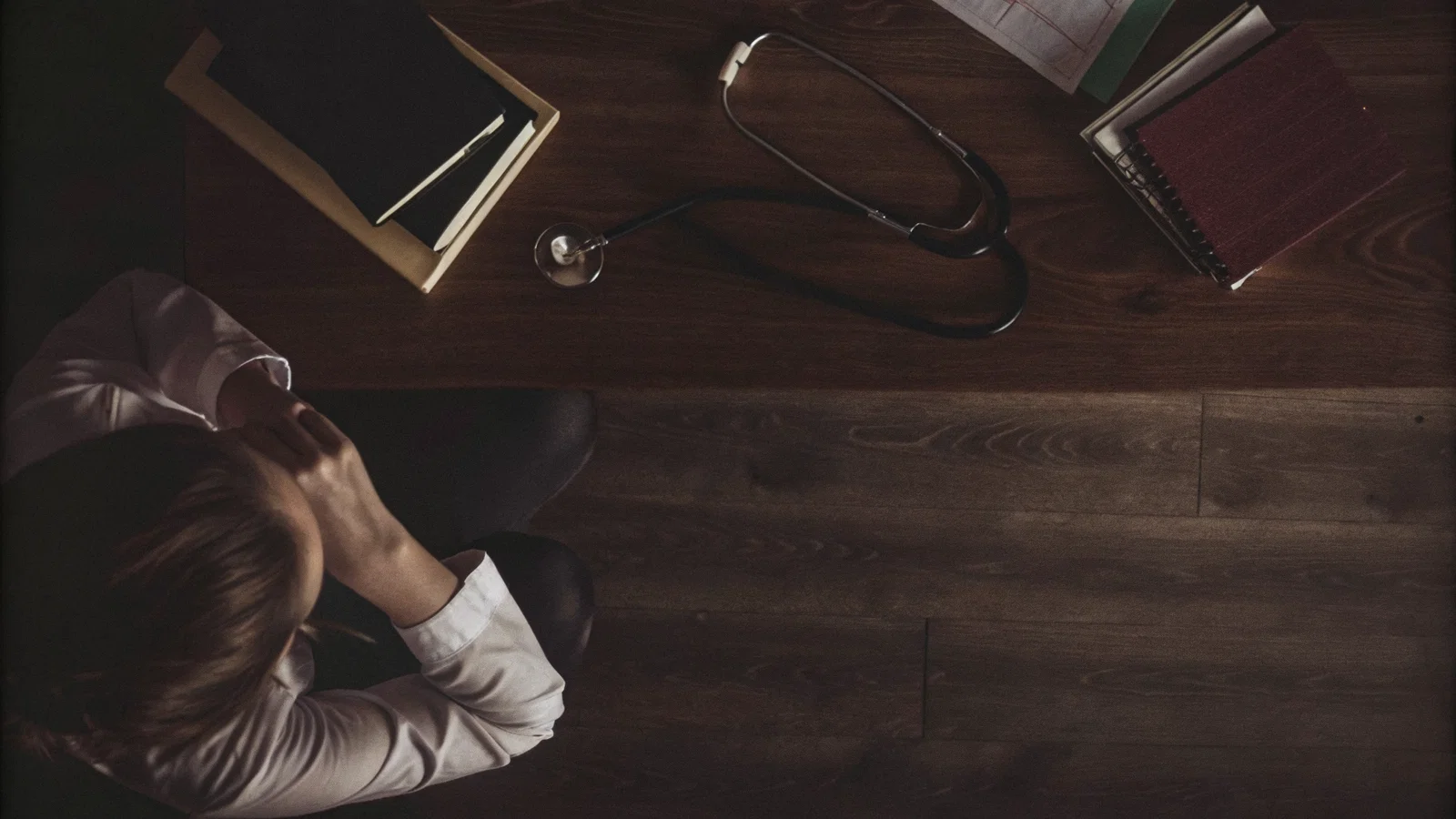 Physician reviewing an online course dashboard with tax notices