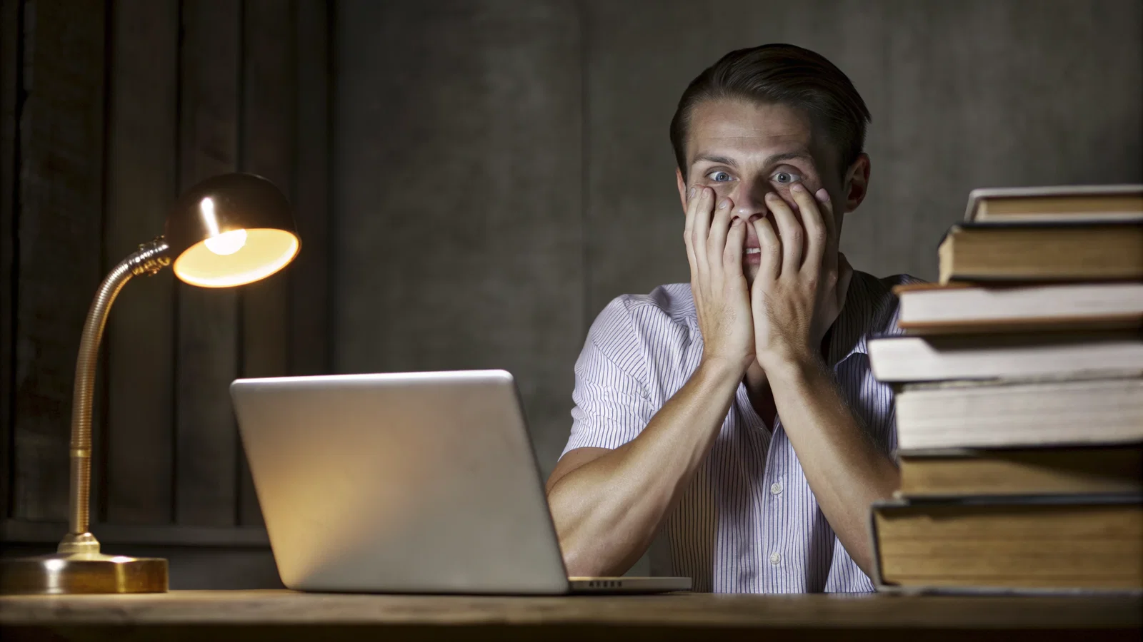 Overwhelmed med student at 3 AM under avalanche of coursework