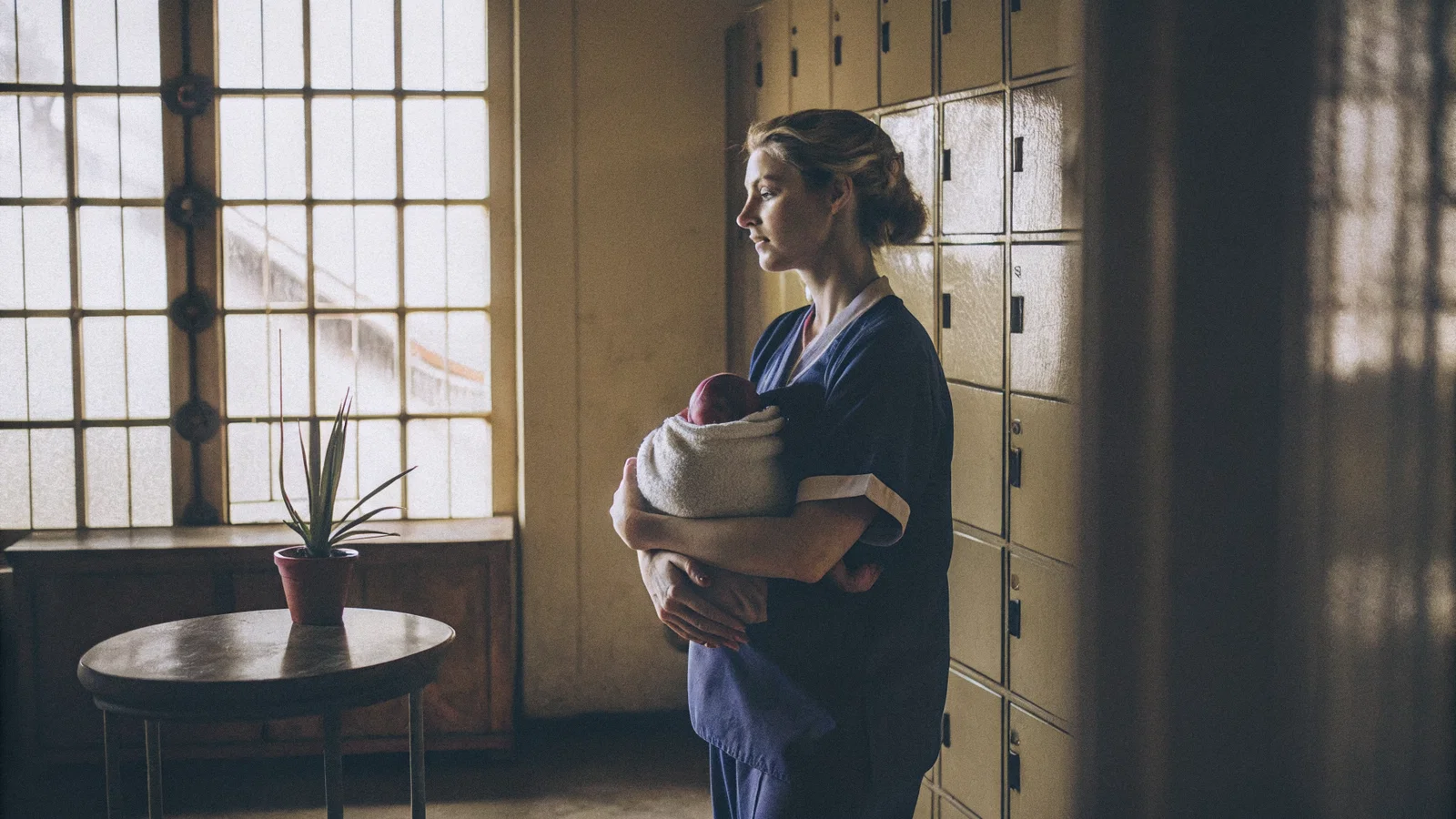 Physician Mother Between Two Clocks