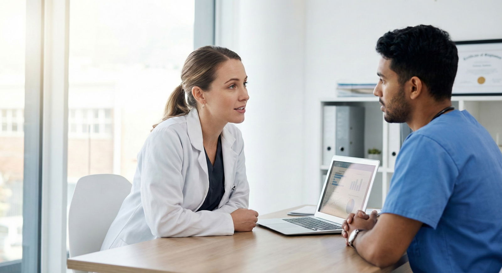 Female resident mentoring a medical student in a quiet hospital office -  for Can I Still Match Competitively If I Reported H